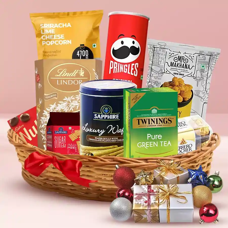 Delicious Christmas Treats Sensations Hamper filled with festive snacks and sweets in a beautifully gift-wrapped chest or basket.