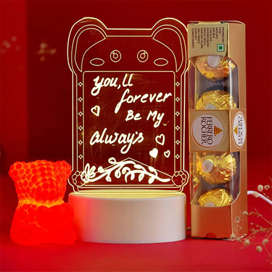 Heartful Gifts N Treats Hamper featuring a customized CD Creative Visualization Lamp, four Ferrero Rocher chocolates, and a red rose-textured teddy bear with a glowing heart.