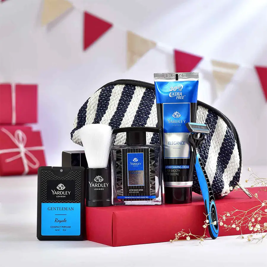 Gentleman’s Grooming Oasis Hamper featuring Yardley London essentials, a shaving brush, a sleek razor, and a vibrant multicolored pouch made from recycled plastic.