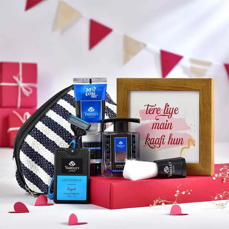 Gentleman's Grooming and Memories Hamper featuring eco-friendly pouch, Yardley London perfume, aftershave lotion, shaving cream, shaving brush, razor, and a 6-inch photo frame