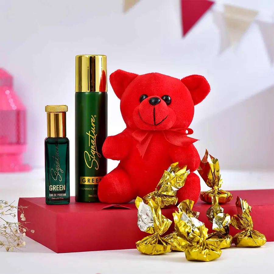 Ultimate Pampering Gift Package featuring a red teddy bear, chocolates, and a green fragrance combo of perfume and deodorant