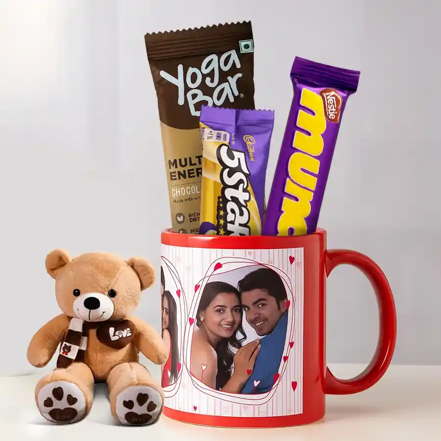 Customized mug, chocolate bars, multigrain energy bar, and teddy bear gift set on a table