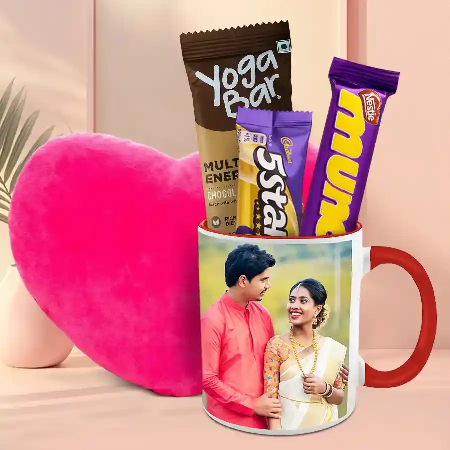 Personalized coffee mug with chocolates and a cozy cushion displayed together in a gift set