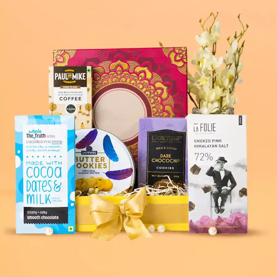 Decadent Gourmet Delight Hamper featuring chocolate bars, cookies, and a reusable gift box