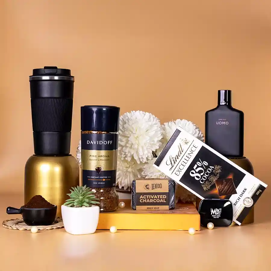 Luxurious Men's Essentials Gift Basket featuring perfume, coffee, dark chocolate, soap, mints, and a coffee mug