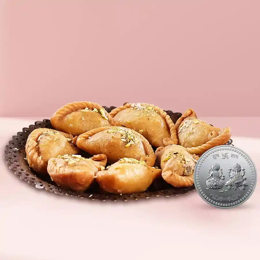 Haldirams Khowa Puri with a silver-plated Ganesh and Laxmi coin for Diwali celebrations
