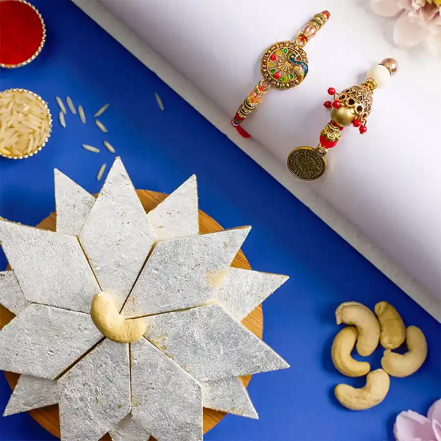 Elegant Kundan Bhaiya Bhabhi Rakhi with Kaju Katli treat and festive offering items