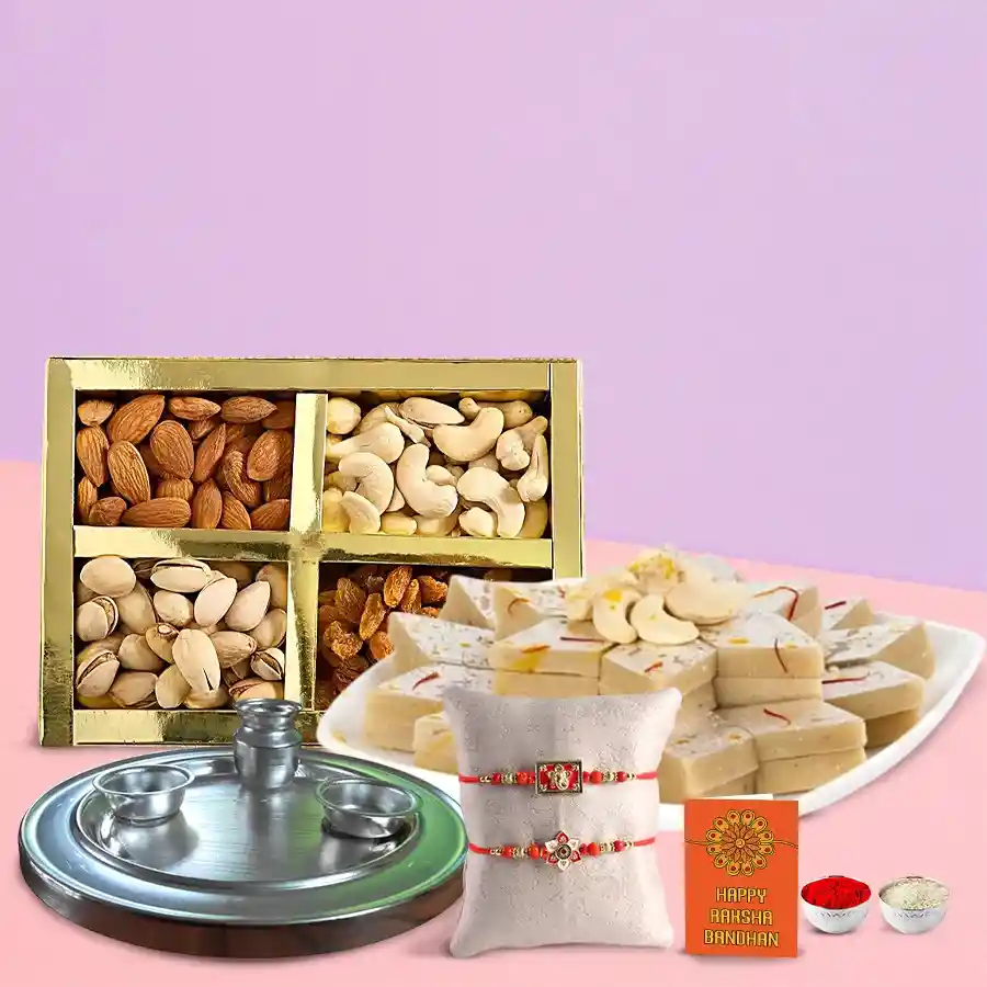 Special Gold Thali featuring elegant gold plating, two complimentary rakhis, 250g of Haldiram Kaju Katli, 250g of premium dry fruits, traditional roli tilak, and chawal, all arranged beautifully for Raksha Bandhan.