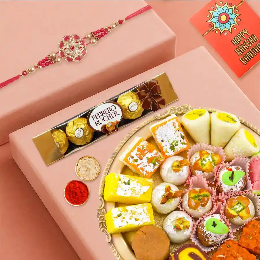 Ferrero Rocher chocolates, Haldiram assorted sweets, and a Rakhi set with Roli, Tilak, and Chawal in a festive arrangement