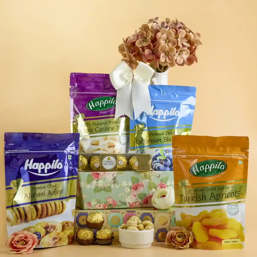Deluxe Gourmet Treats Gift Basket featuring Turkish apricots, Californian blueberries, Afghani Anjeer, and Ferrero Rocher chocolates arranged in a reusable designer basket