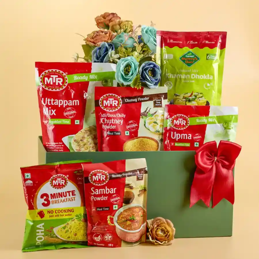 Ultimate South Indian Cuisine Essentials Hamper featuring MTR Uttappam Mix, Chutney Powder, Upma Mix, Khaman Dhokla Instant Mix, Sambar Masala, and 3-Minute Breakfast Poha in a reusable Designer Basket.