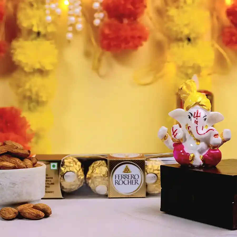 Sweet Blessings Ganesh Set featuring a Mukut Ganesh idol, Ferrero Rocher chocolates, and crunchy almonds in a beautifully arranged packaging