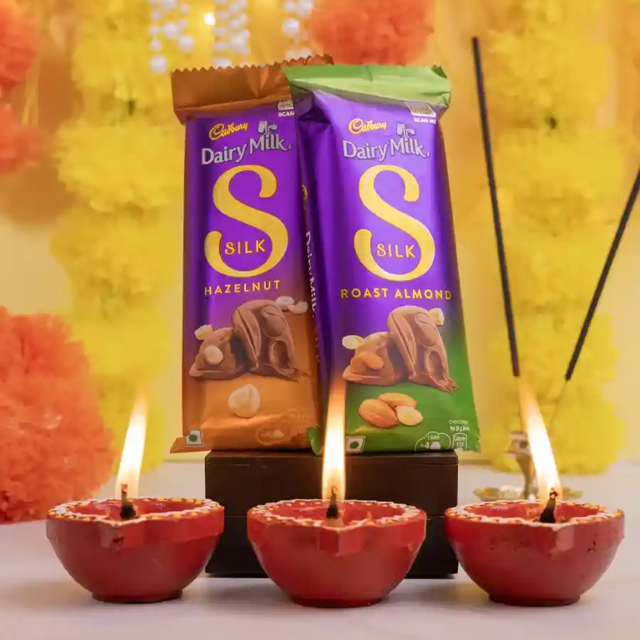 Indulgent Silk Chocolate N Diya Gift Box featuring Cadbury Dairy Milk Silk chocolates and Mud Diyas