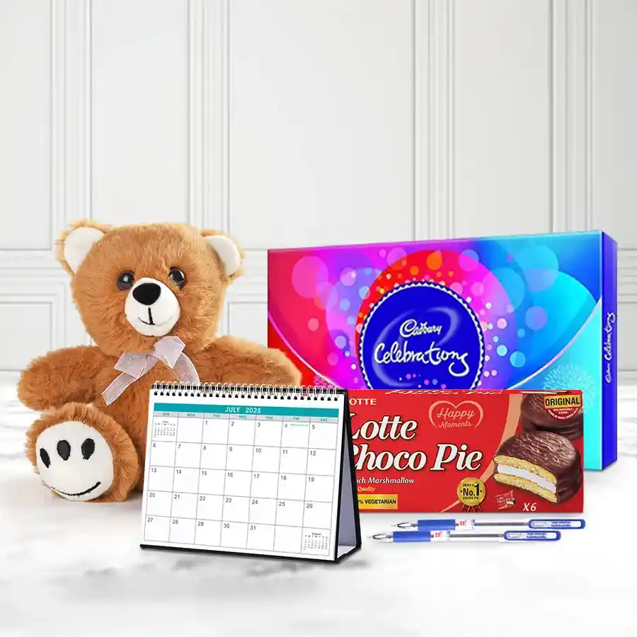 A beautifully arranged collection of New Year gift items including a stylish desk calendar, a cuddly teddy bear, two sleek ballpoint pens, and an assortment of Chocopie and chocolates.