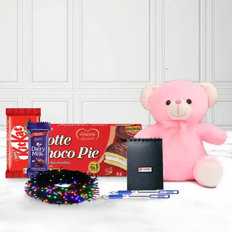 Luscious Collection of New Year Delicacies including a teddy bear, ballpoint pens, pocket diary, Chocopie, and assorted chocolates arranged in an elegant gift presentation.