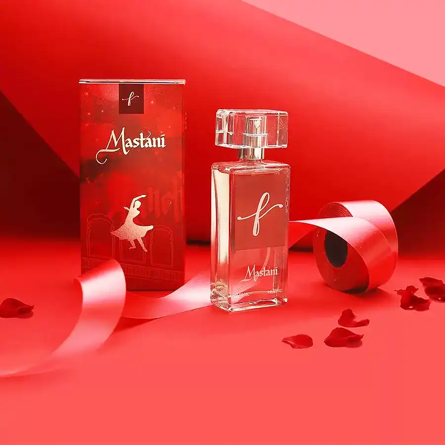 Mastani Eau de Parfum Regal Allure bottle with floral and wooden background