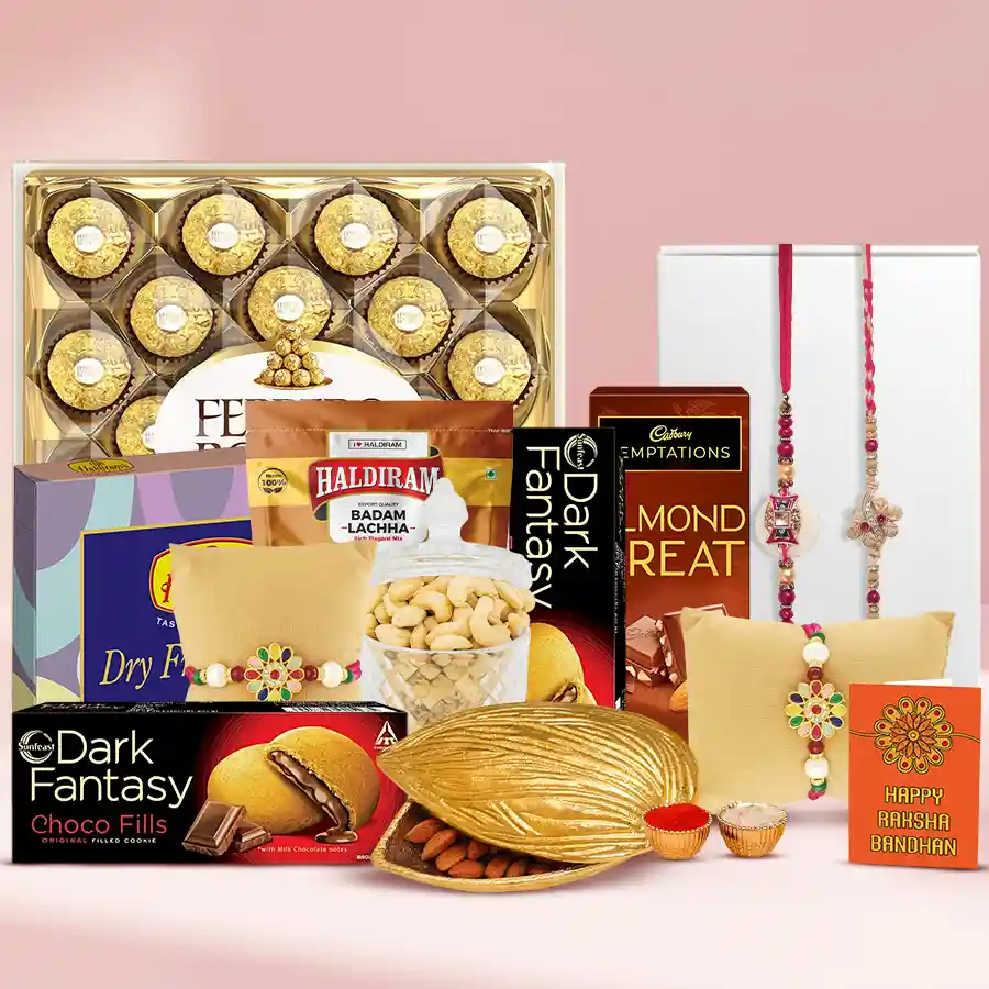 Designer pearl rakhi set with chocolates, dry fruits, and festive treats.