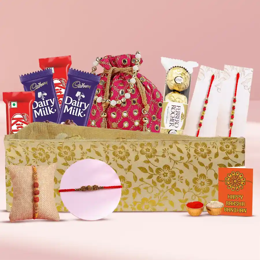 Fancy Bead and Rudraksha Rakhi gift pack with chocolates and cashews arranged on a designer tray