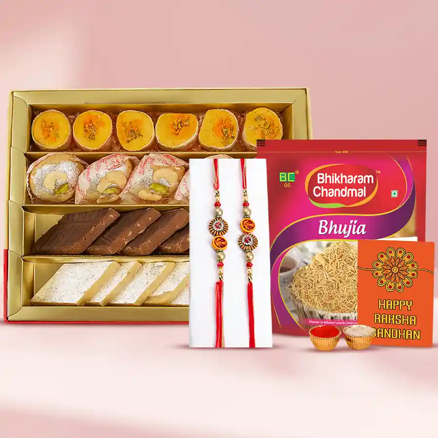 Ravishing stone rakhi pair with assorted sweets and snacks for Raksha Bandhan celebration