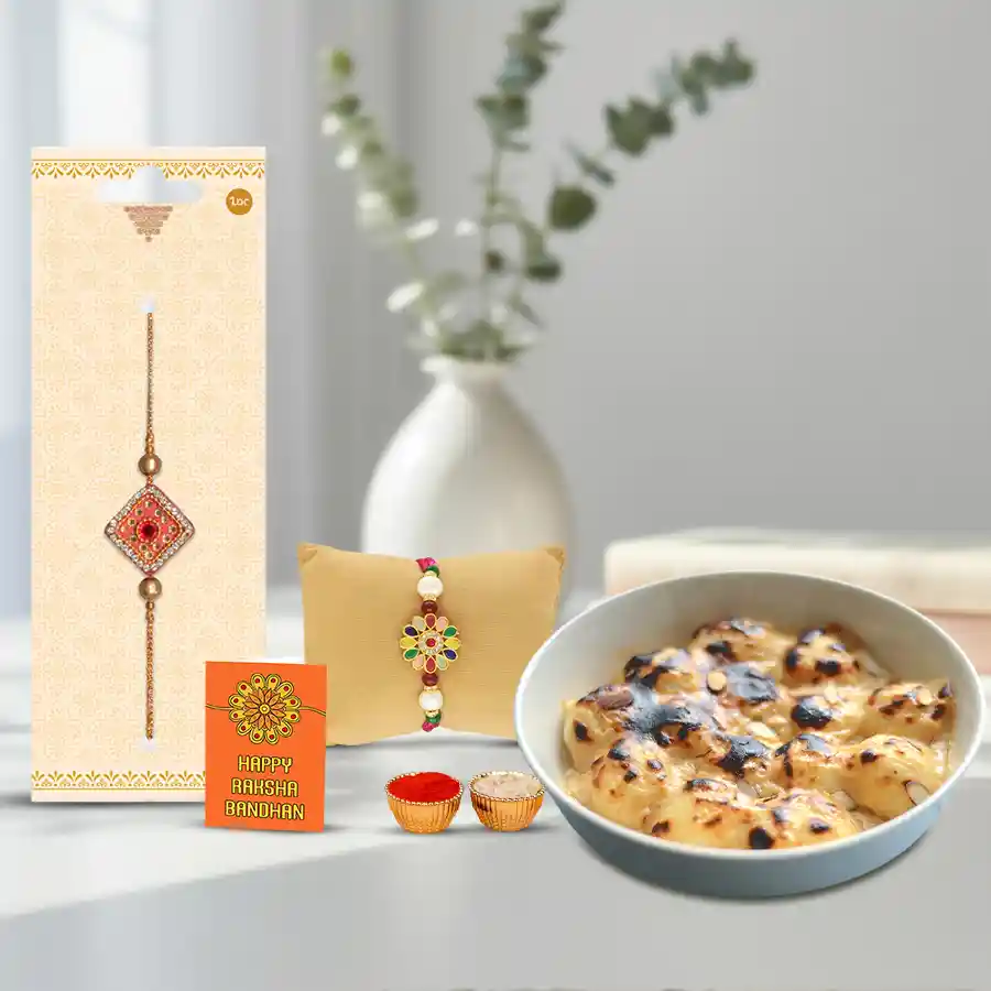 Toothsome Rasgulla from Balaram Mullick with two ethnic rakhis, a Rakhi greeting card, and traditional offerings of roli, tika, and chawal.