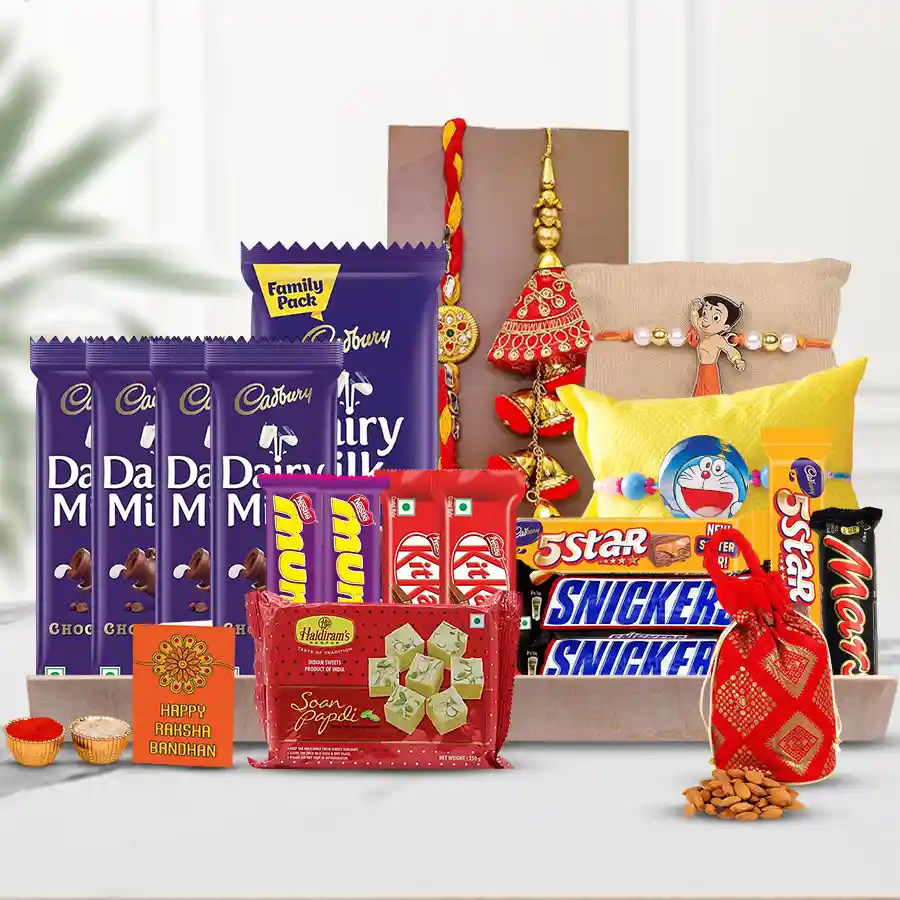 A beautifully arranged assortment of chocolates, traditional sweets, a family Rakhi, and festive accessories on a wooden tray, showcasing a mix of treats for Rakhi celebration.