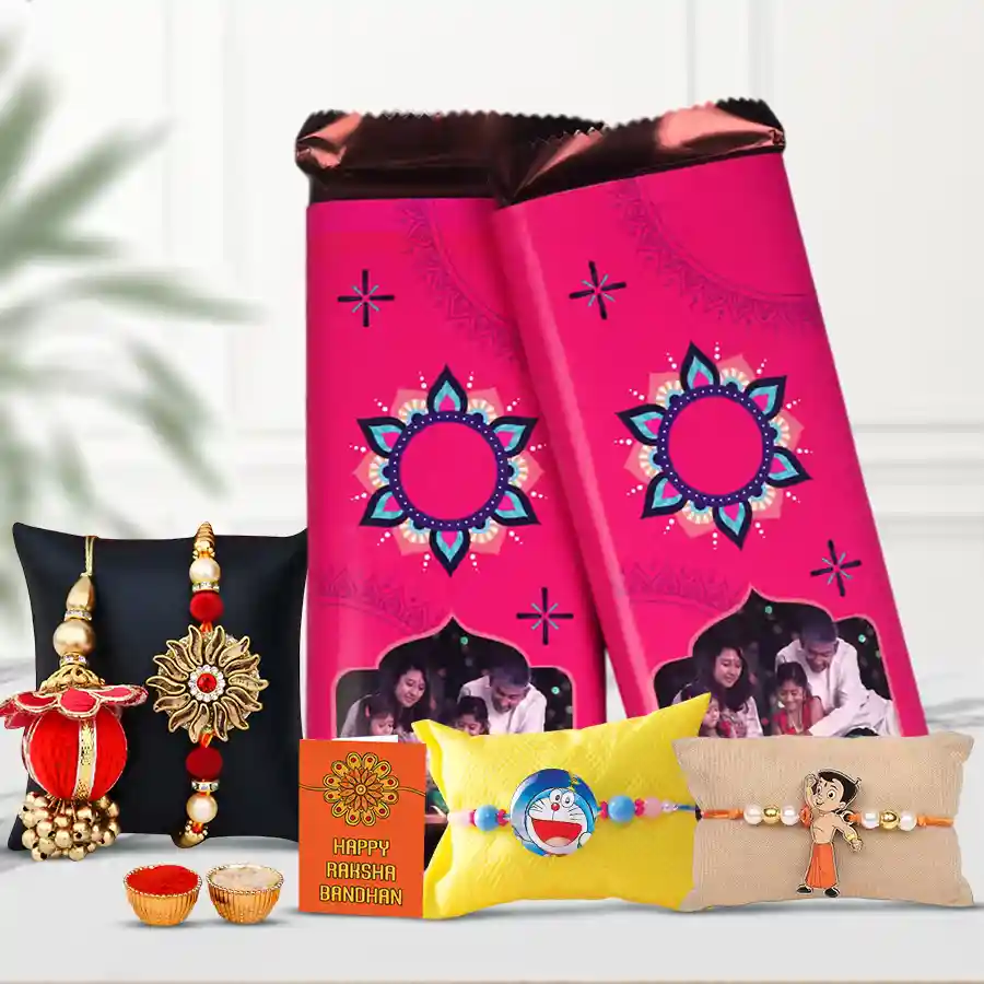 Family Time with Personalized Cadbury Treat gift set featuring two personalized Cadbury Silk Chocolate Bars, a family Rakhi set, a free Rakhi, and traditional Roli Tika N Chawal, all presented beautifully to celebrate Raksha Bandhan.