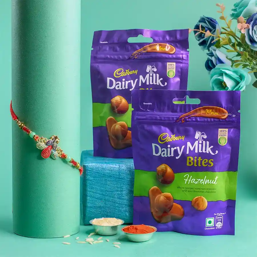 Charming Peacock Rakhi N Cadbury Hazelnut Bites Combo