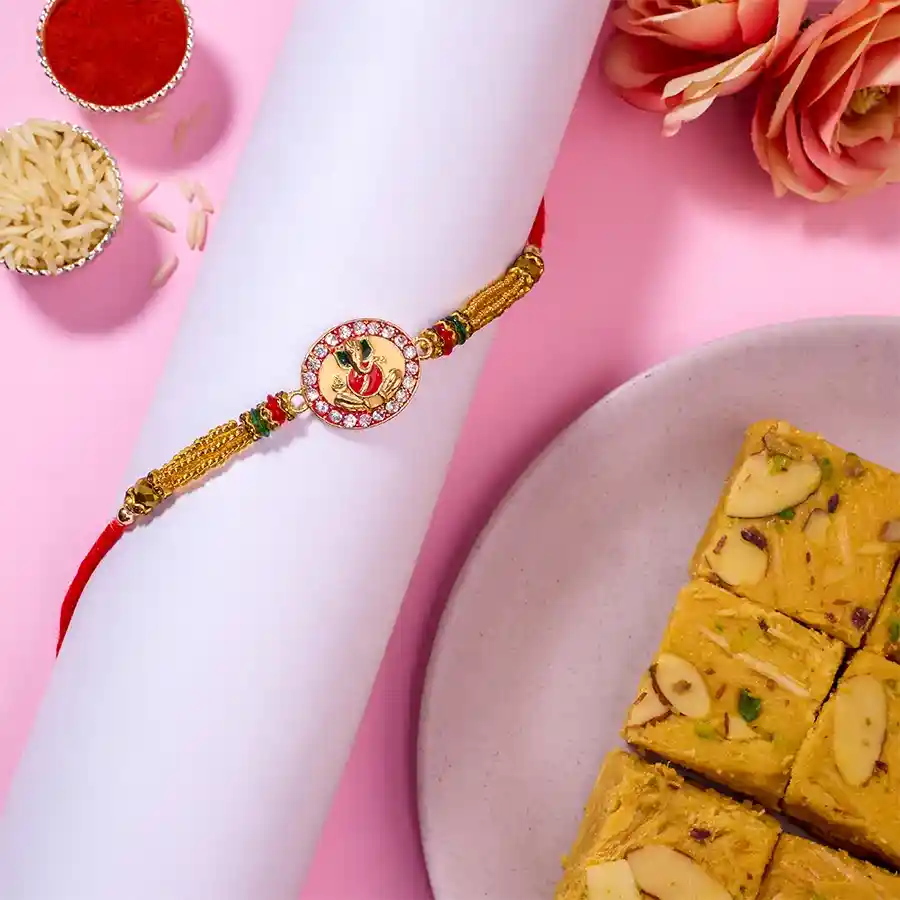 Charming Ganesha Kundan Rakhi N Soan Papdi Combo
