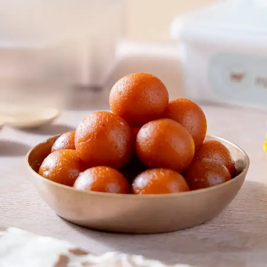500g box of Mini Gulabjamoon, soft and sweet dough balls soaked in sugar syrup.