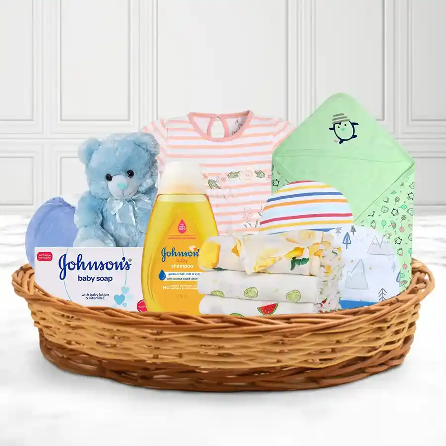 Delightful Baby Essentials Gift Basket featuring Johnson's Baby products and cute baby items in a reusable cane basket.