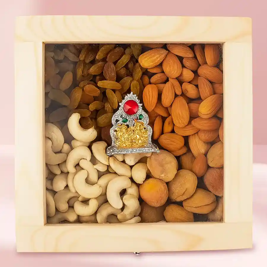 Beautiful wooden box filled with assorted dry fruits and an antique Ganesh Laxmi Mandap, perfect for gifting.