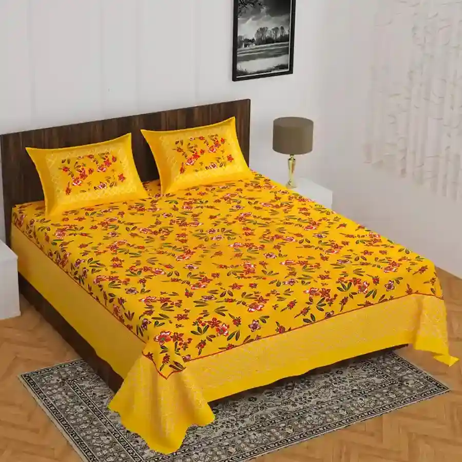 Vibrant Jaipuri Print Double Bed Sheet and Pillow Covers in bright yellow, showcasing floral designs, perfect for a king-sized bed.