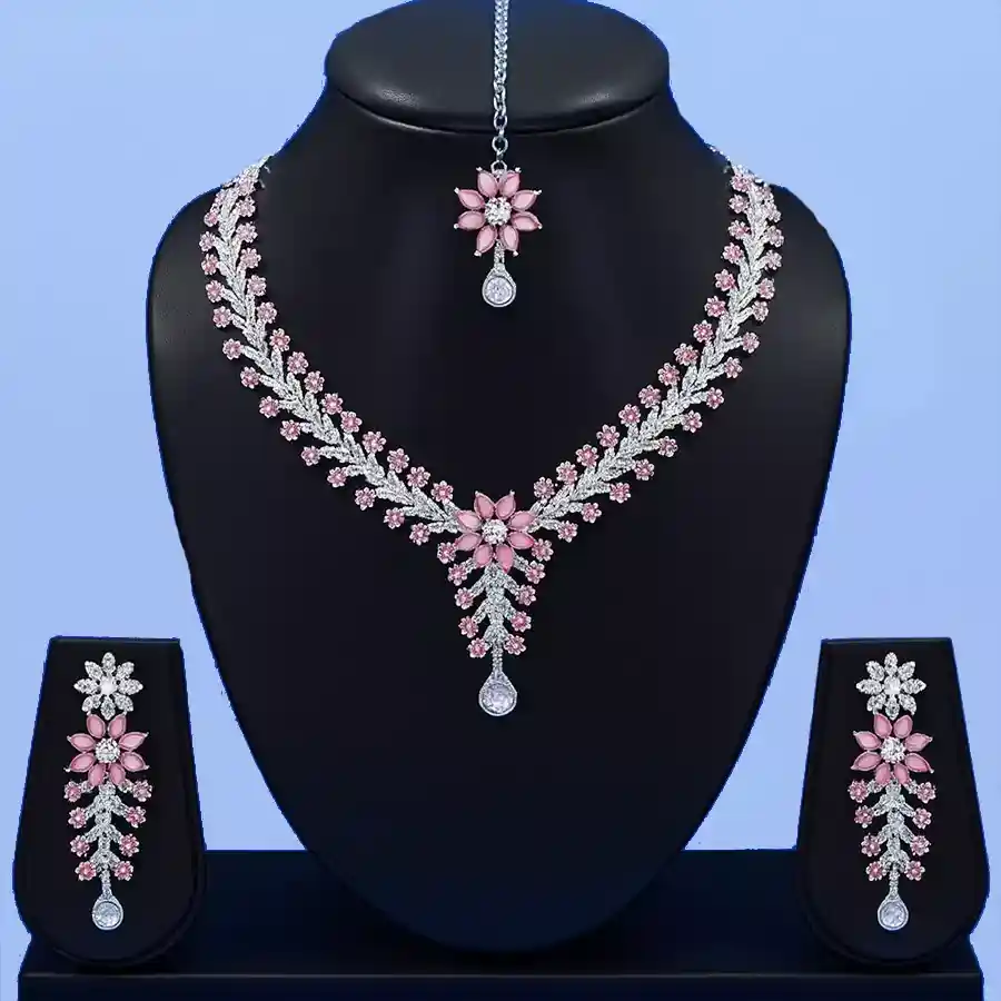 Elegant Crystal Jewelry Ensemble featuring a necklace, earrings, and maang tikka in a beautiful gift box.