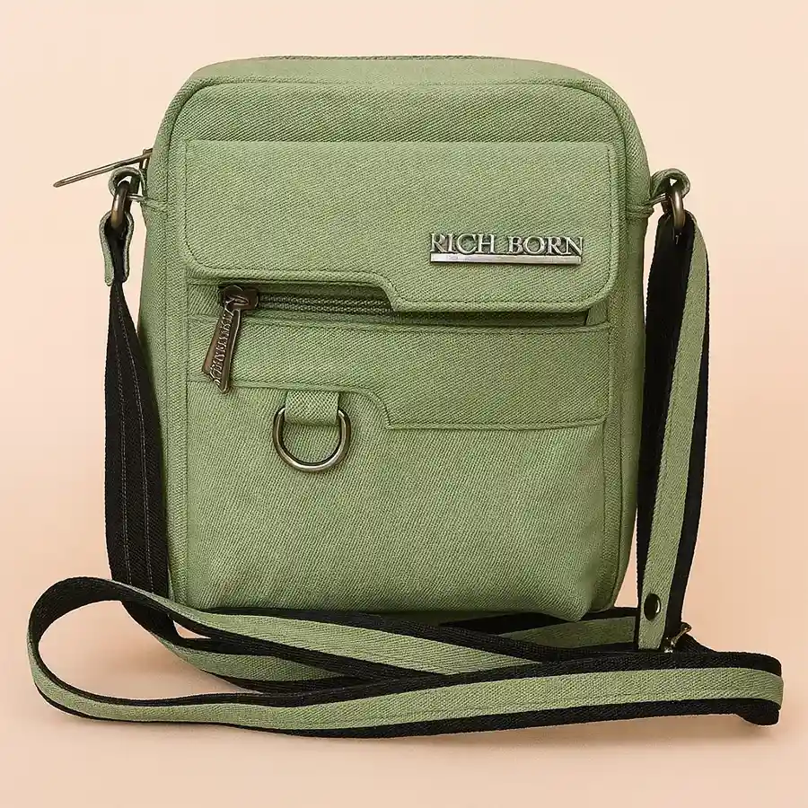 Stylish Men's Jeans Finish Sling Bag in green foam leather with front pocket.