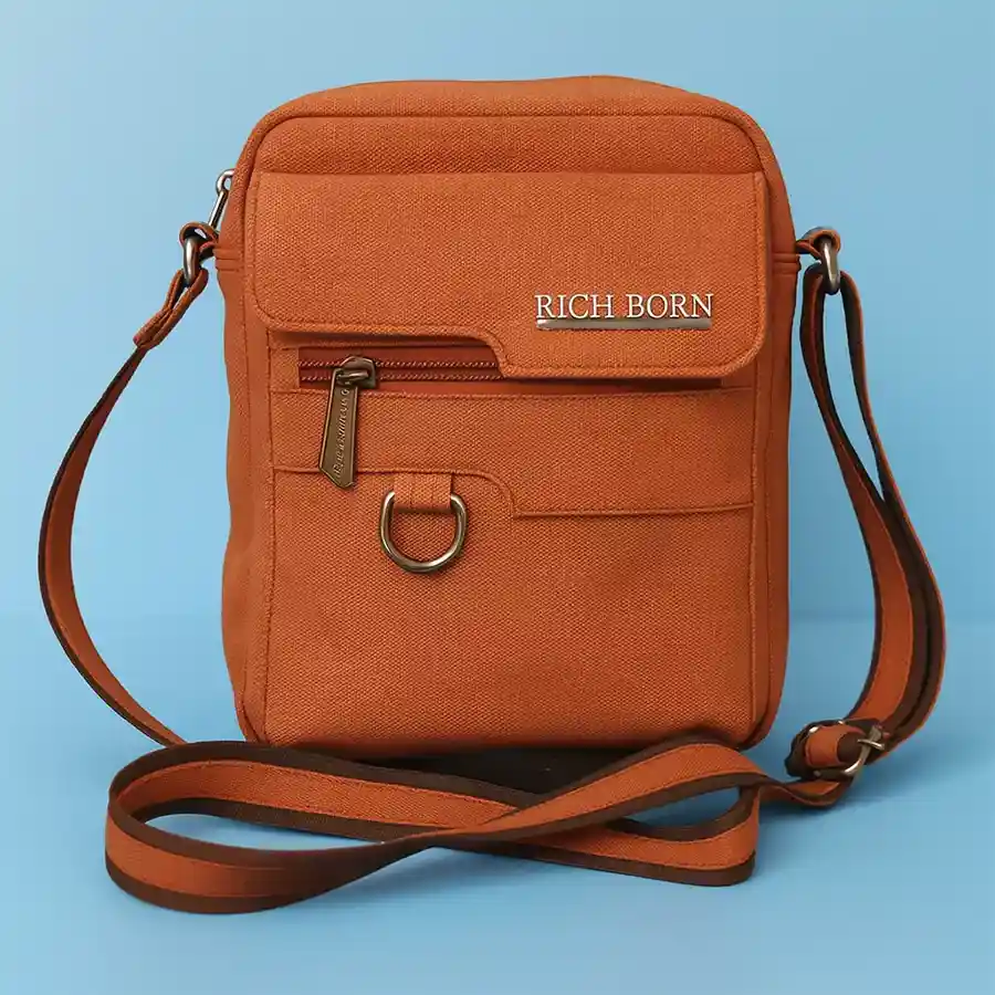 Stylish Tan Sling Bag for Men with jeans finish and front pocket.