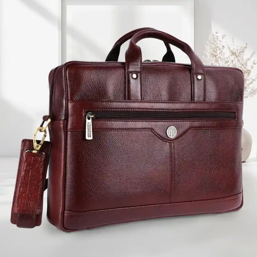 Splendid Leather Laptop Bag in brown, designed for men, featuring multiple compartments and an adjustable shoulder strap for easy carrying.