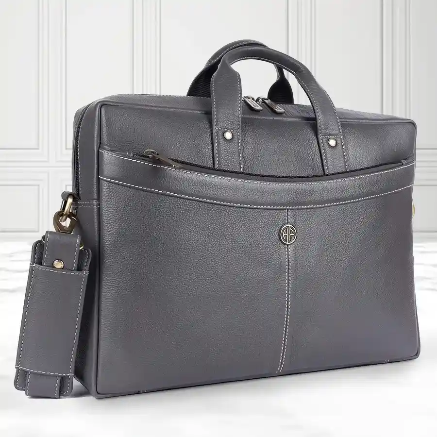 Stylish grey leather laptop bag designed for men, fits up to 16-inch laptops, featuring multiple compartments and a 1-year warranty.