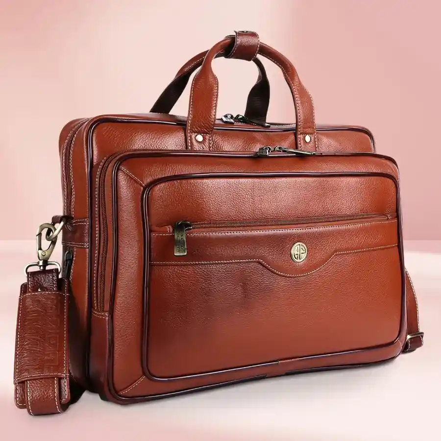 Tan leather laptop bag for men, fits up to 16-inch laptop, stylish and functional design.