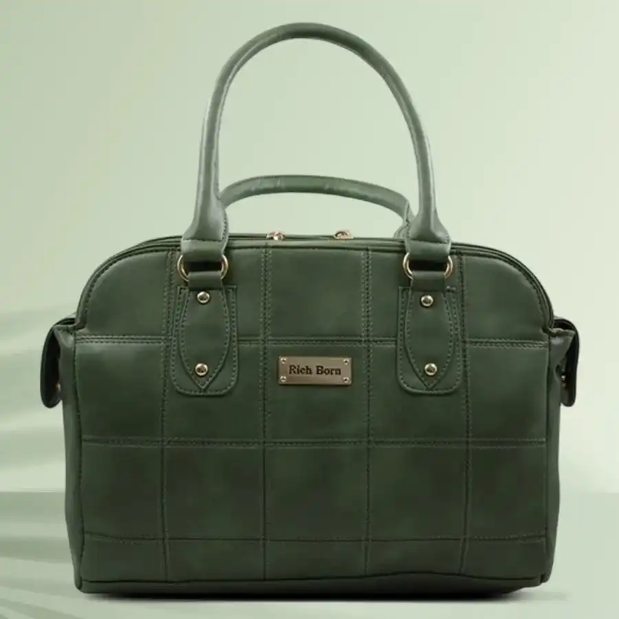 Exclusive smart stitch design ladies vanity bag in green faux leather with detachable shoulder strap and three spacious chambers.