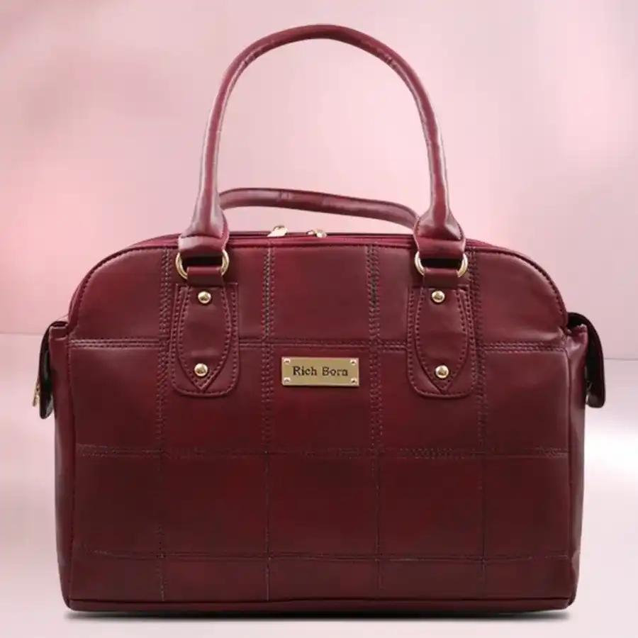 Chic maroon faux leather shoulder bag for women with detachable strap and three compartments, perfect for everyday use.