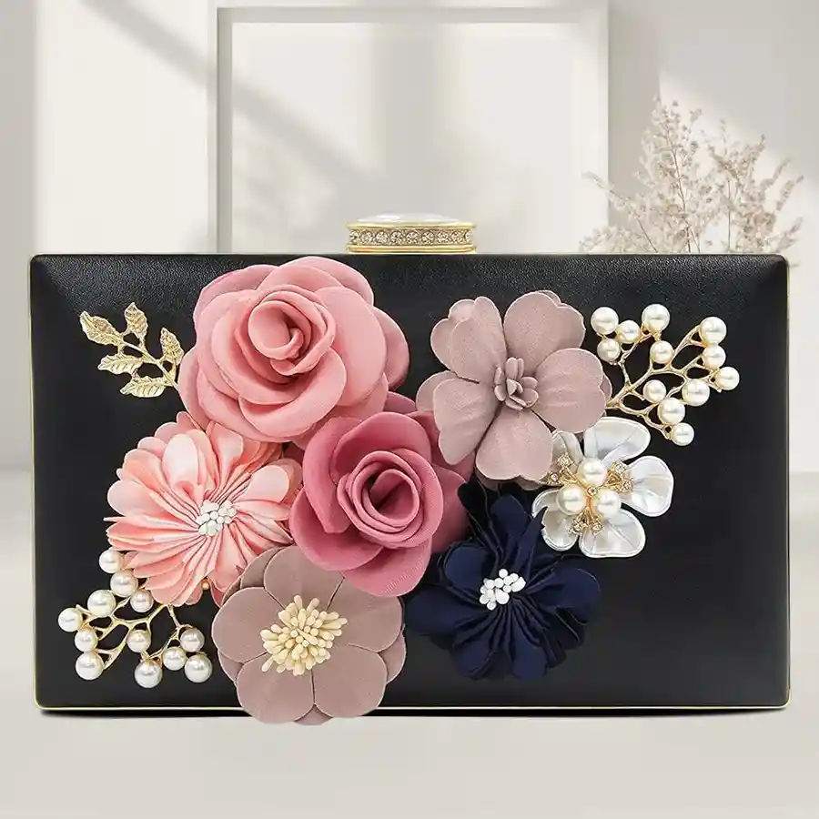 Elegant black floral evening clutch for women, featuring faux leather, intricate floral design, and a versatile chain strap. Perfect for parties and special occasions.