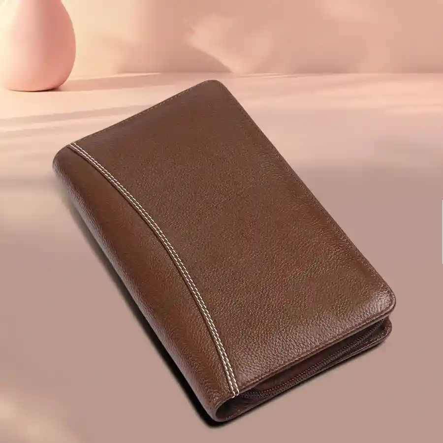 Elegant leather passport holder in Brushwood with multiple card slots, designed for stylish and organized travel.